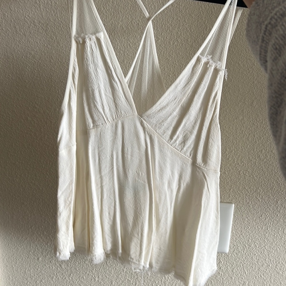 Cream tank top. Mesh on the back. Size M.